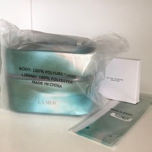 New La Mer Cosmetic bag, includes mirror and small scarf to tie around the bag